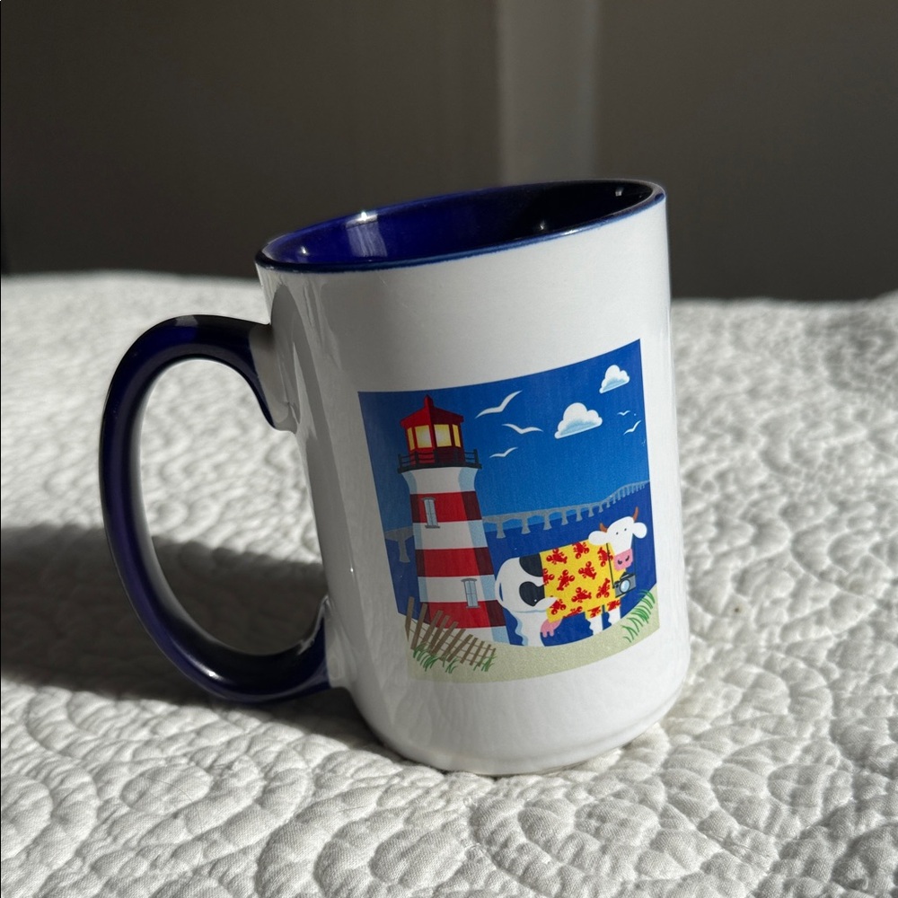Navy-Trim Ceramic Mug with Lighthouse & Cow Illustration